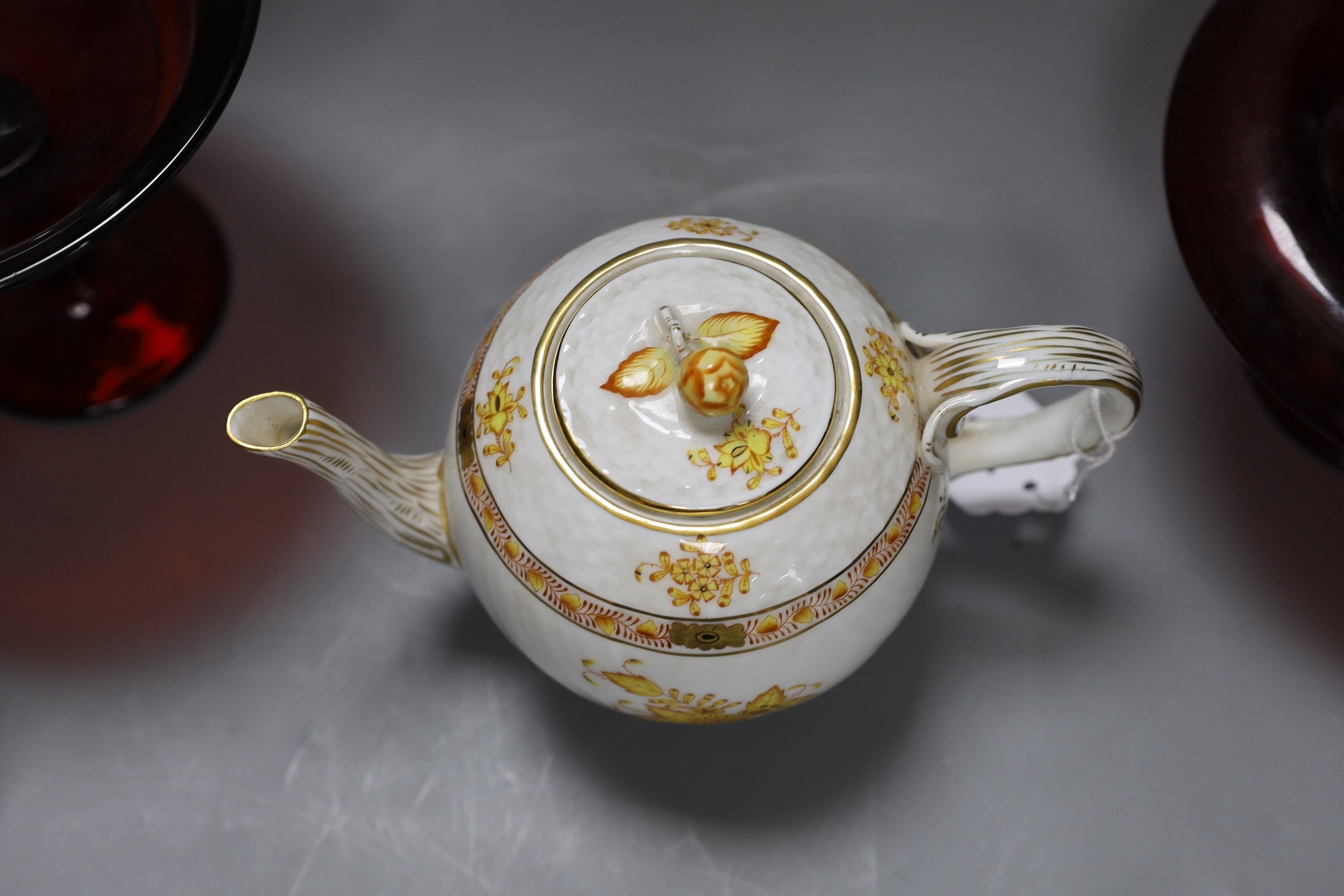 A Meissen figure of boy, two Meissen twin section salts, a Herend teapot and two matchbox holders, two ruby glass comports etc (11), teapot 13 cms high